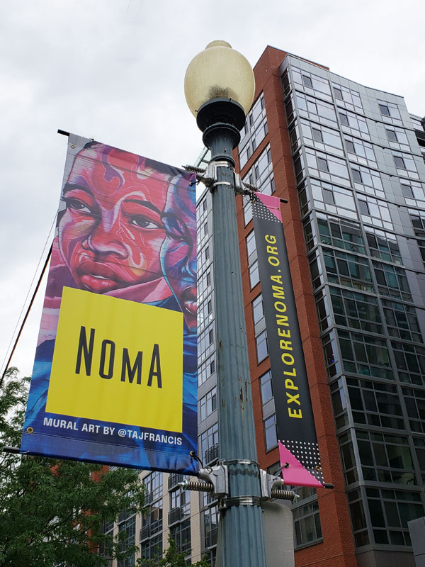 noma neighborhood mural sign