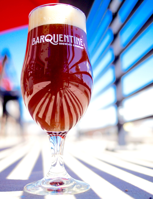 red ale on patio with rows of shadows